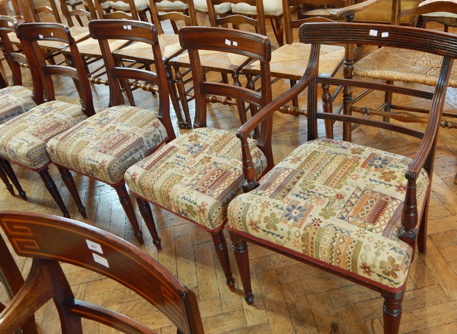 Matched set of Regency mahogany dining chairs with bar backs, upholstered stuff-over seats,