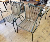 Set of four 1960's Danish chairs by Daneline, dark green tubular metal with slat backs,