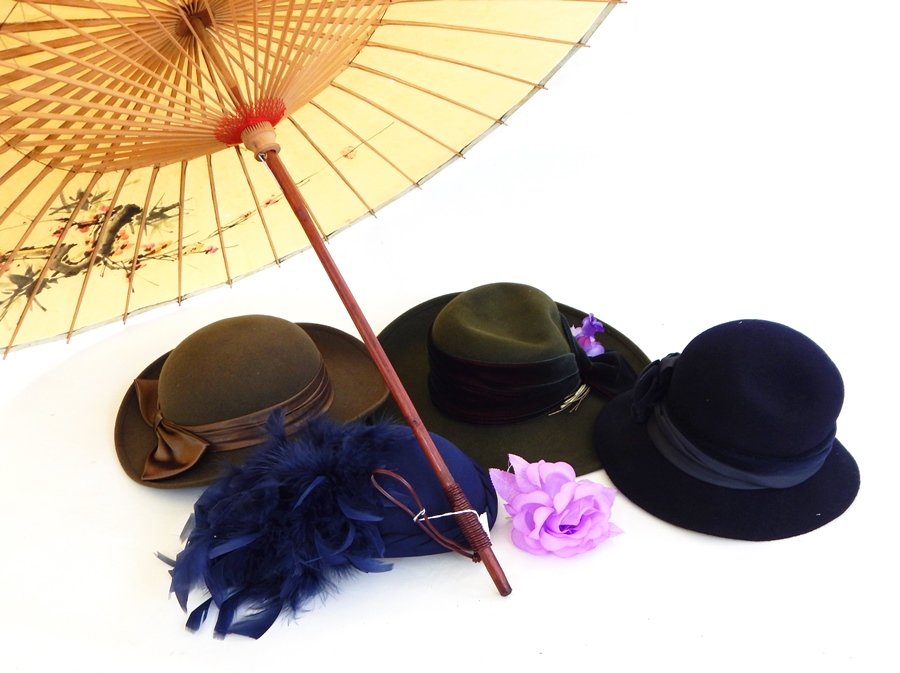 A Japanese paper parasol decorated inside and out with apple blossom, various felt lady's hats, a