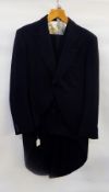 A morning suit with black jacket,