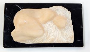 Alabaster sculpture of reclining female in foetal position with hair fanned out around her head,