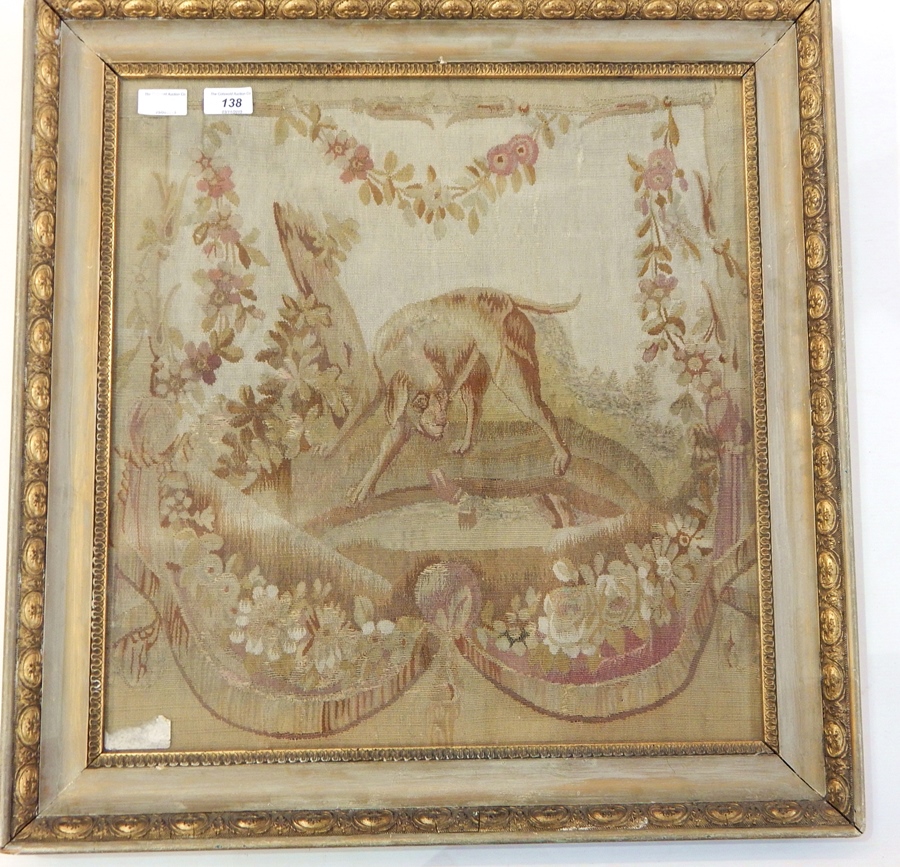 A fragment of woven material, possible 18th century showing a hunting dog with a hare, within