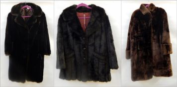 Three various simulated fur coats