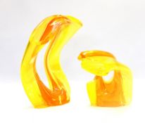 A contemporary glass sculpture of Madonna and child, in two sections, in yellow and orange,