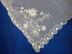 A white embroidered wedding veil