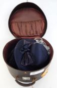 An 'Antler' hat box with shipping labels, an astrakhan and velvet Russian-style hat "Handmade by