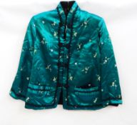 A satin Chinese style jacket lined with wool, black frogging fastenings and black lace detail