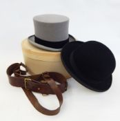 A grey top hat by Christys' London, size 71/8, a bowler hat, a leather belt with brass fittings