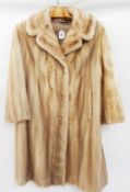 A blonde mink full-length coat  Live Bidding: If you would like a condition report on this lot,