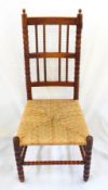 Ernest Gimson yew rush-seated chair made by Edward Gardiner with two pointed finials to the bobbin
