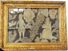 An 18th century(?) woolwork picture showing a gentleman and lady, he appears to be holding a pole