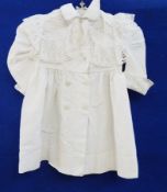 A child's cotton coat with a full broderie anglaise collar, double-breasted, a cotton baby gown with