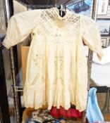 A selection of christening gowns and baby gowns including two silk baby gowns with lace and