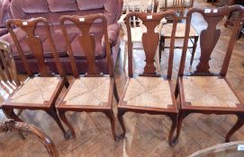 A set of four fiddle back dining chairs,