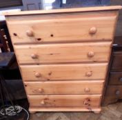 A pine chest of five long drawers, turned and bun feet,