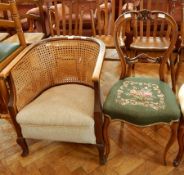 A Victorian walnut hoop back dining chair with pierced and scroll carved back,