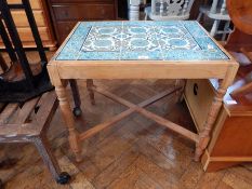 A coffee table with Isnic-style tiled top and turquoise edging,
