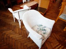 A white painted Lloyd Loom style armchair,