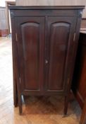 A reproduction cased oak bookcase, with pair of doors with leaded lights, enclosing shelf space,