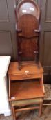 An early 20th century mahogany folding double cakestand together with a pale wood telephone table