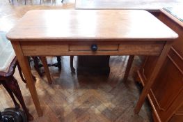 A mahogany rectangular top side table with a small frieze drawer, on square tapering legs,