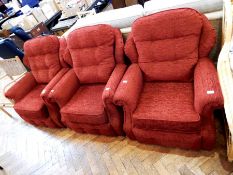 Three woven red armchairs