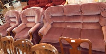 A three-piece suite with three seater sofa,