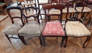 A Victorian rosewood balloon back chair on turned legs, a stained beech balloon back chair,