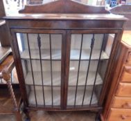 20th century Chippendale style oak bow front glazed bookcase,