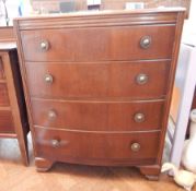 Mid 20th century oak bow-front chest of four drawers, raised on bracket feet,
