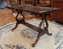 A reproduction mahogany rectangular top coffee table with piecrust border,