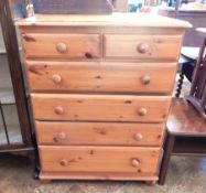 Modern pine chest of two short and four long graduated drawers on feet,