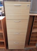 A modern oak veneer four drawer filing cabinet, with steel handles,