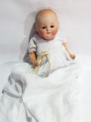 Theodore Rechnagel bisque headed baby doll inscribed "Germany 3 R138A", with blue sleeping eyes,