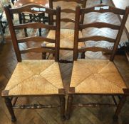 Harlequin set of seven oak ladderback dining chairs with rush seats,