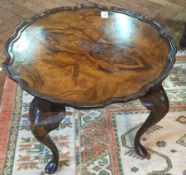 Reproduction walnut veneer circular top coffee table with moulded piecrust border on cabriole legs