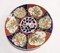 Pair Japanese Imari porcelain plaques, each circular with central floral circular panel,