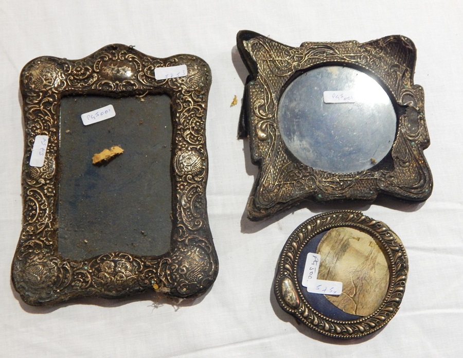 Three silver photograph frames,