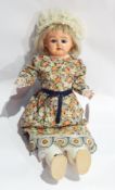 Composition shoulderhead doll with blue sleeping eyes, open mouth,