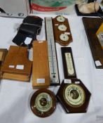 An aneroid barometer, another barometer,