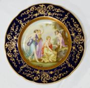 Continental porcelain plate painted with allegorical scene "Aimer am Pranger" within blue and gilt
