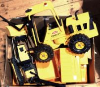 A quantity of large tinplate Tonka toys to include campervan, fire engine, forklift, digger, etc.