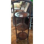 A mid 20th century oak three tier cake stand with beadwork decoration