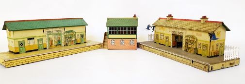 A Hornby 'O' gauge station with electric lamps, walk thorugh and printed bookstall,