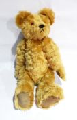 A collectors bear by Asquiths of Windsor, golden mohair, jointed, orange/black plastic eyes,