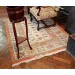 A Persian style wool rug with cream field, geometric and stylised floral decoration,
