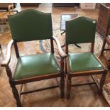 A set of six oak dining chairs with upholstered brass studded backs, cushion seats,