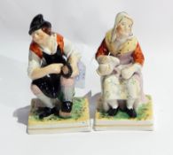 Pair 19th century earthenware seated figures of a cobbler and woman with jug,