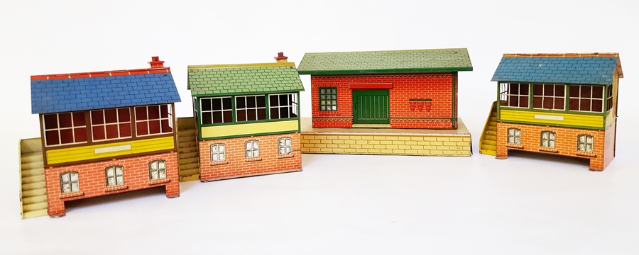 A Hornby goods shed with red brickwork and green roof,