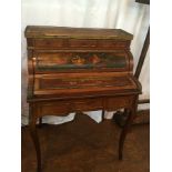 A Louis XVI style mahogany bureau de dame with brass gallery surround,